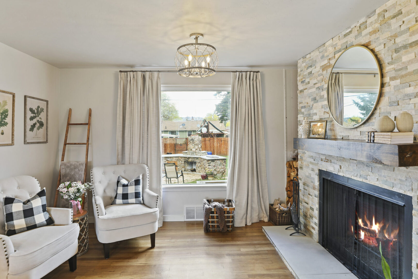 A living room with a fireplace and a chair