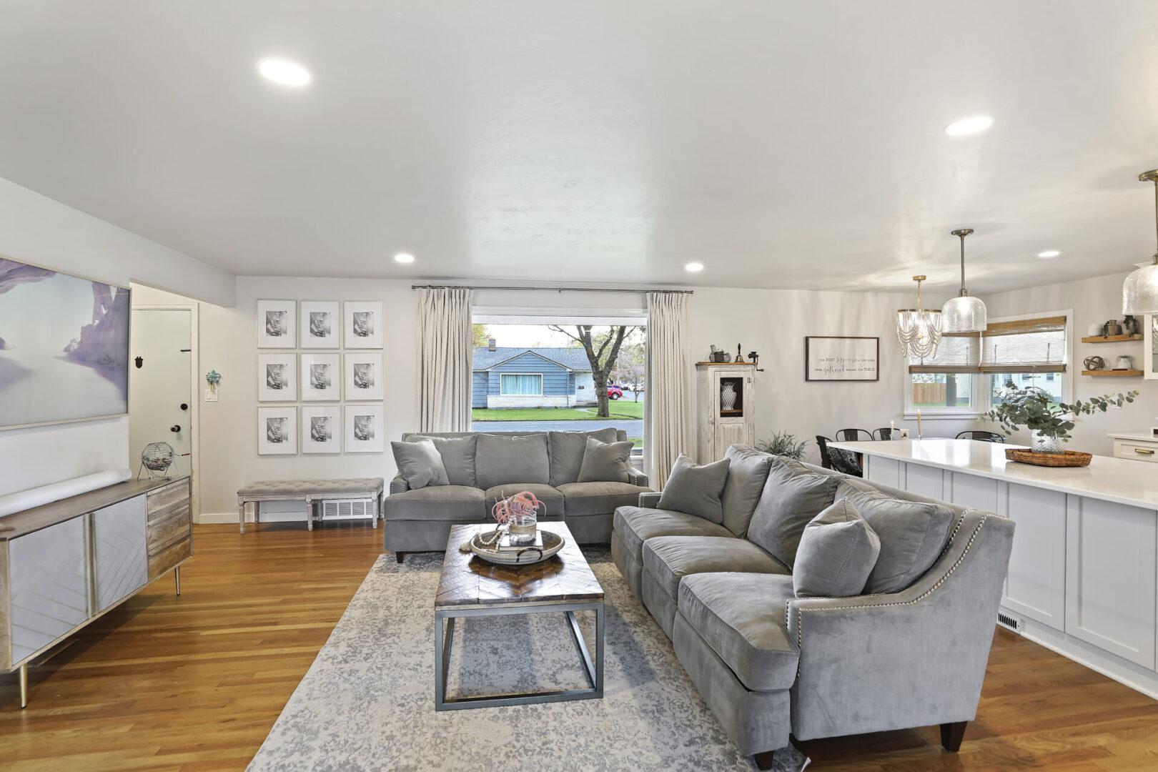 A living room with a gray sofa set